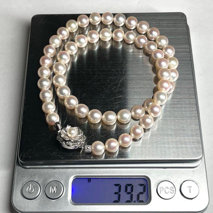 Akoya pearl necklace with 7.5-8.0mm white pearls and silver clasp displayed on white background