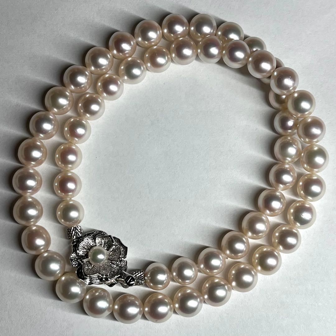 Akoya pearl necklace with 7.5-8.0mm white pearls and silver clasp displayed on white background