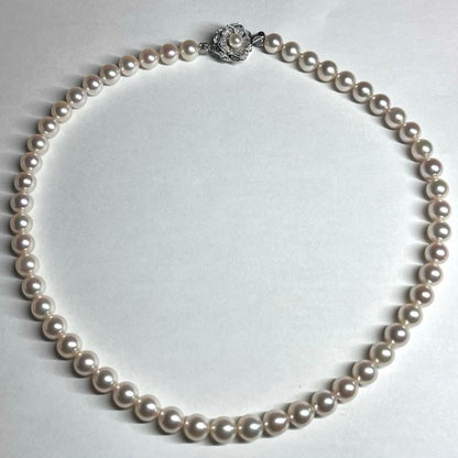 Akoya pearl necklace with 7.5-8.0mm white pearls and silver clasp displayed on white background