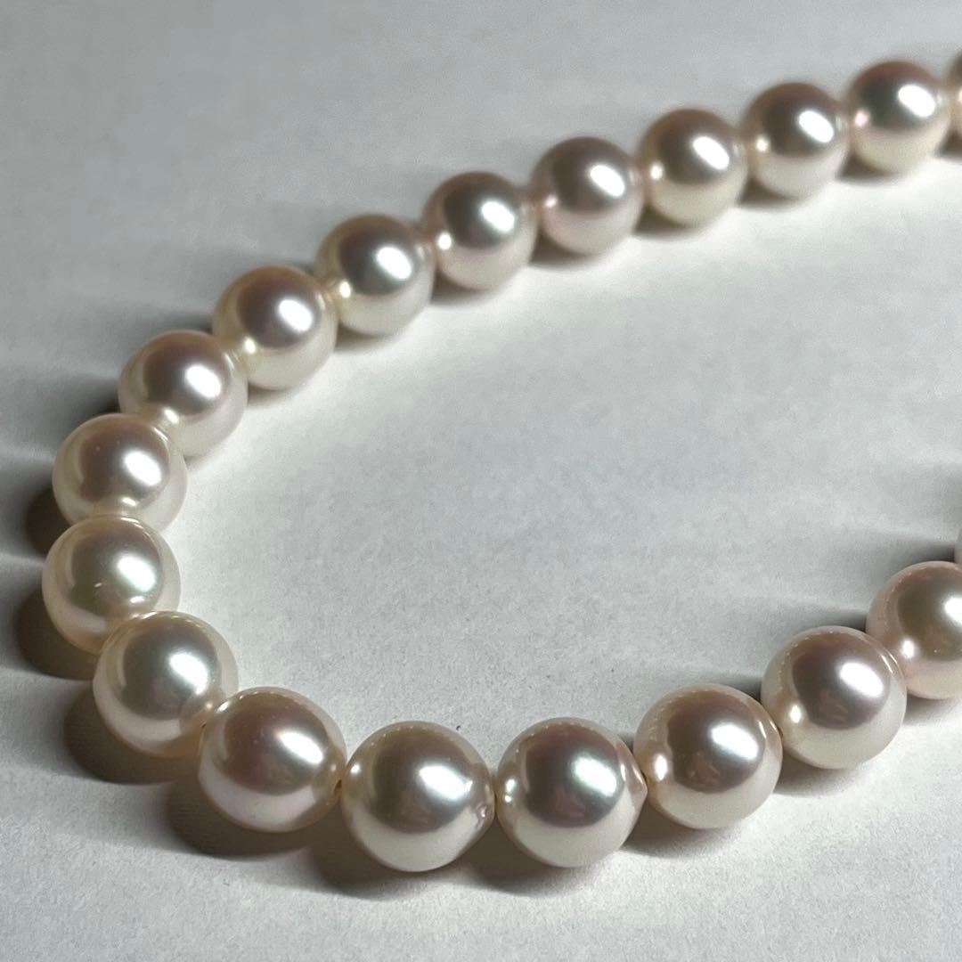 Akoya pearl necklace with 7.5-8.0mm white pearls and silver clasp displayed on white background