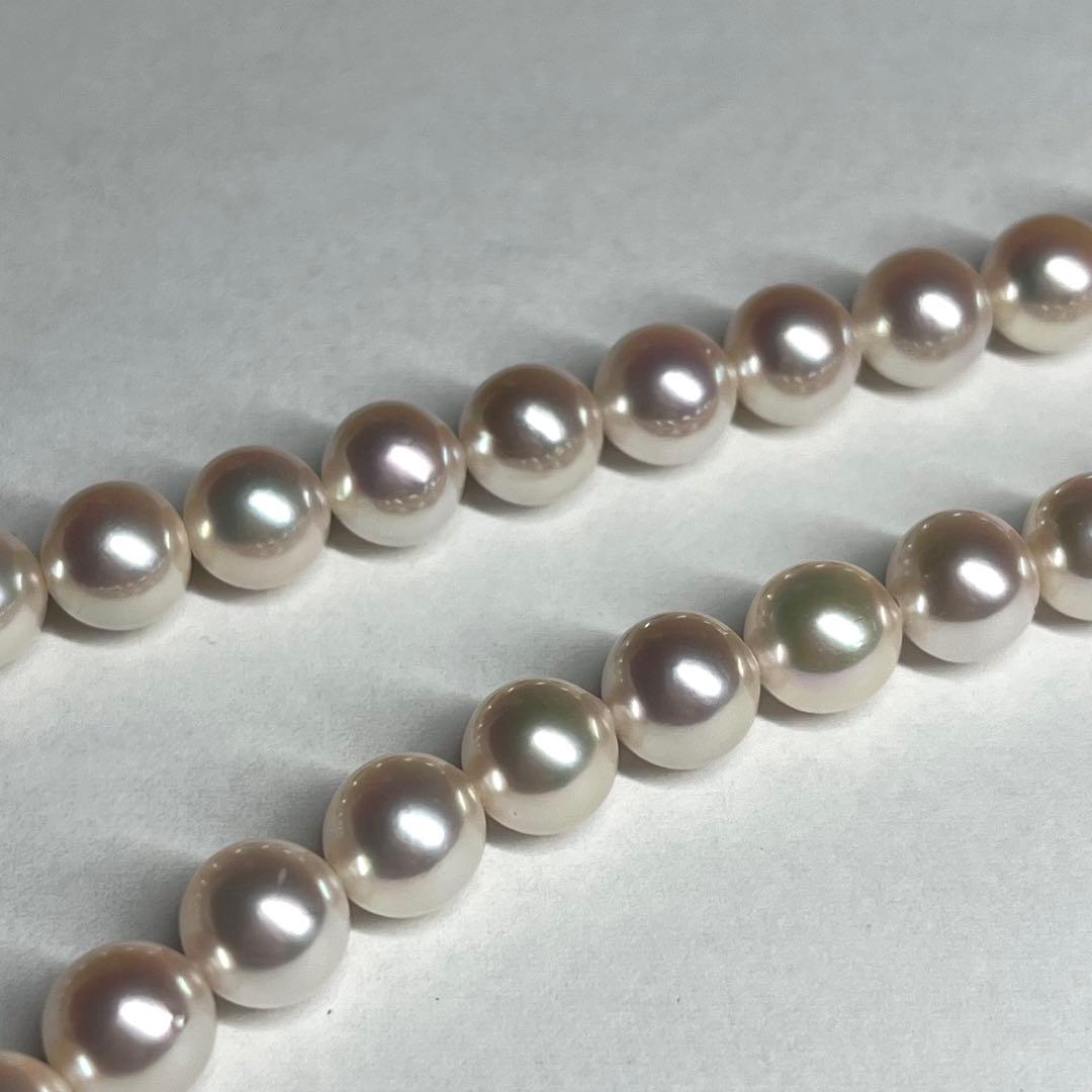 Akoya pearl necklace with 7.5-8.0mm white pearls and silver clasp displayed on white background