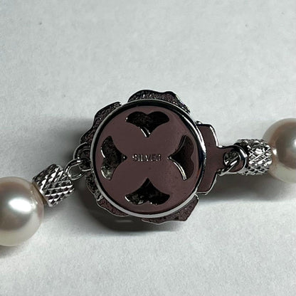 Akoya pearl necklace with 7.5-8.0mm white pearls and silver clasp displayed on white background