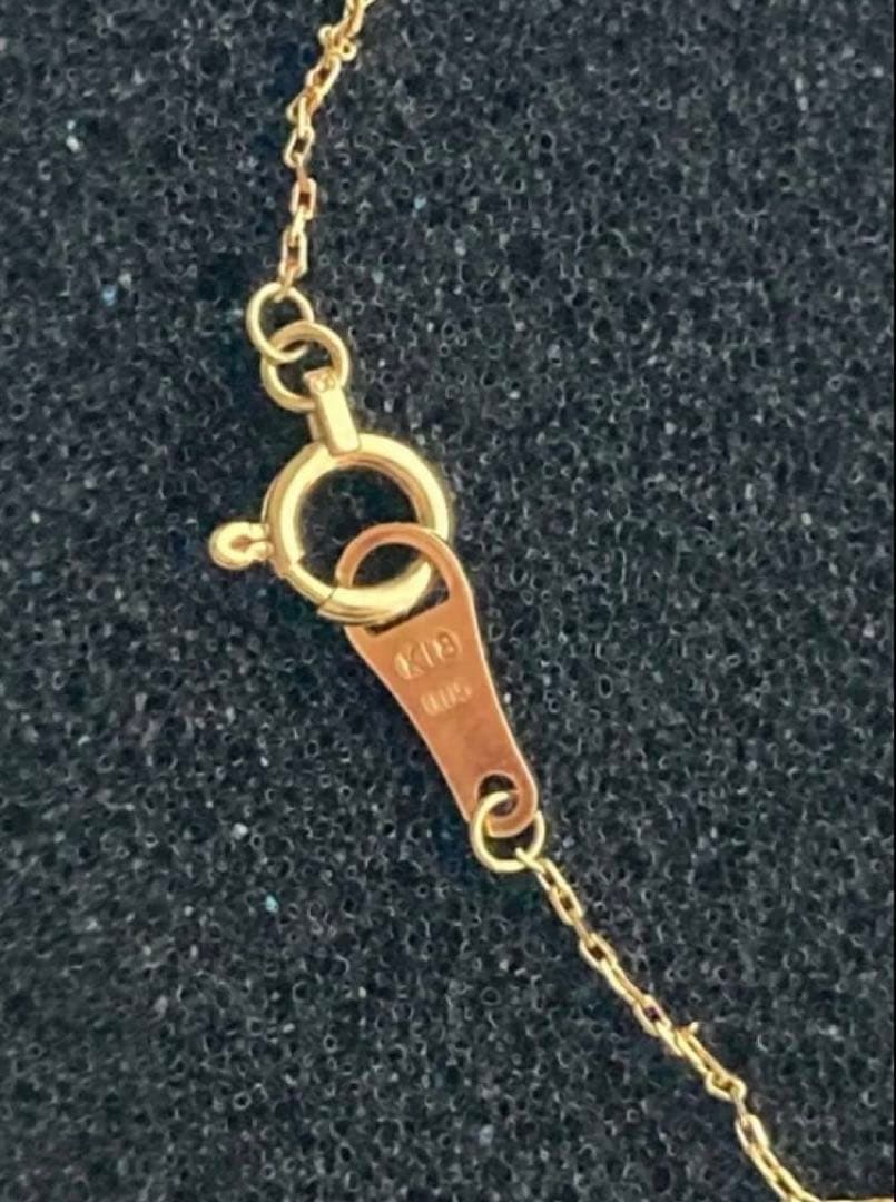 Agate K18 gold necklace featuring a single 0.05 ct diamond on a delicate chain