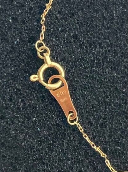 Agate K18 gold necklace featuring a single 0.05 ct diamond on a delicate chain