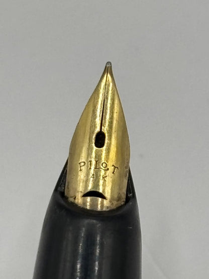 PILOT 14K fountain pen with black body and gold cap featuring an inset nib and 14k engraving