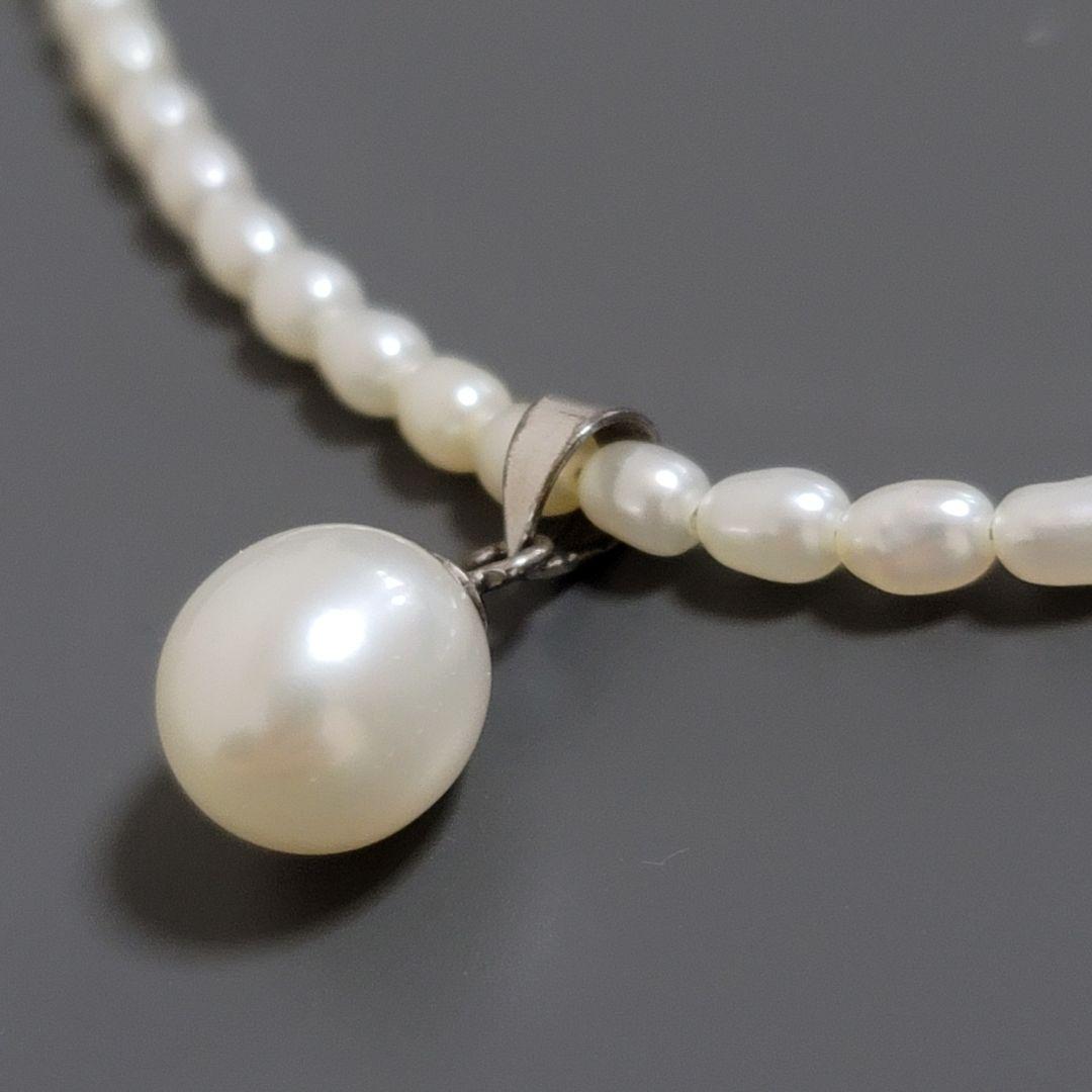 Suzunoya pearl necklace with small oval Akoya pearls and 925 silver clasp on white background