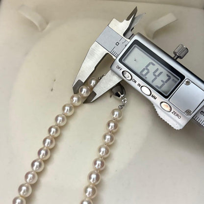 Akoya pearl necklace featuring 7.0mm round white pearls with aurora interference color on a 43cm strand