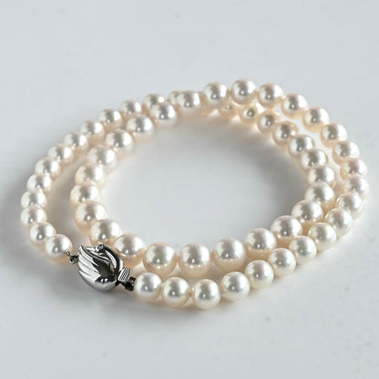 Takashi Akoya pearl necklace featuring 8.8mm round white pearls with WGK14 clasp on 45.5 cm chain