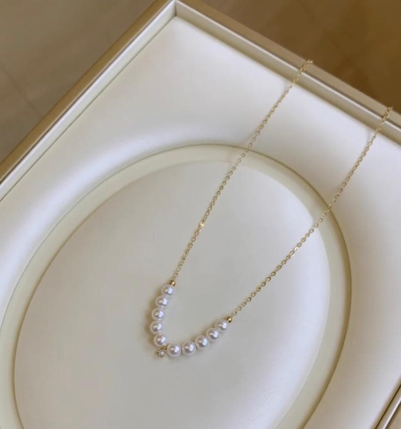 K18YG Akoya pearl necklace pendant featuring an 18K gold smile design with 40+5 cm length
