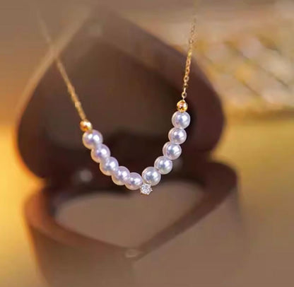 K18YG Akoya pearl necklace pendant featuring an 18K gold smile design with 40+5 cm length