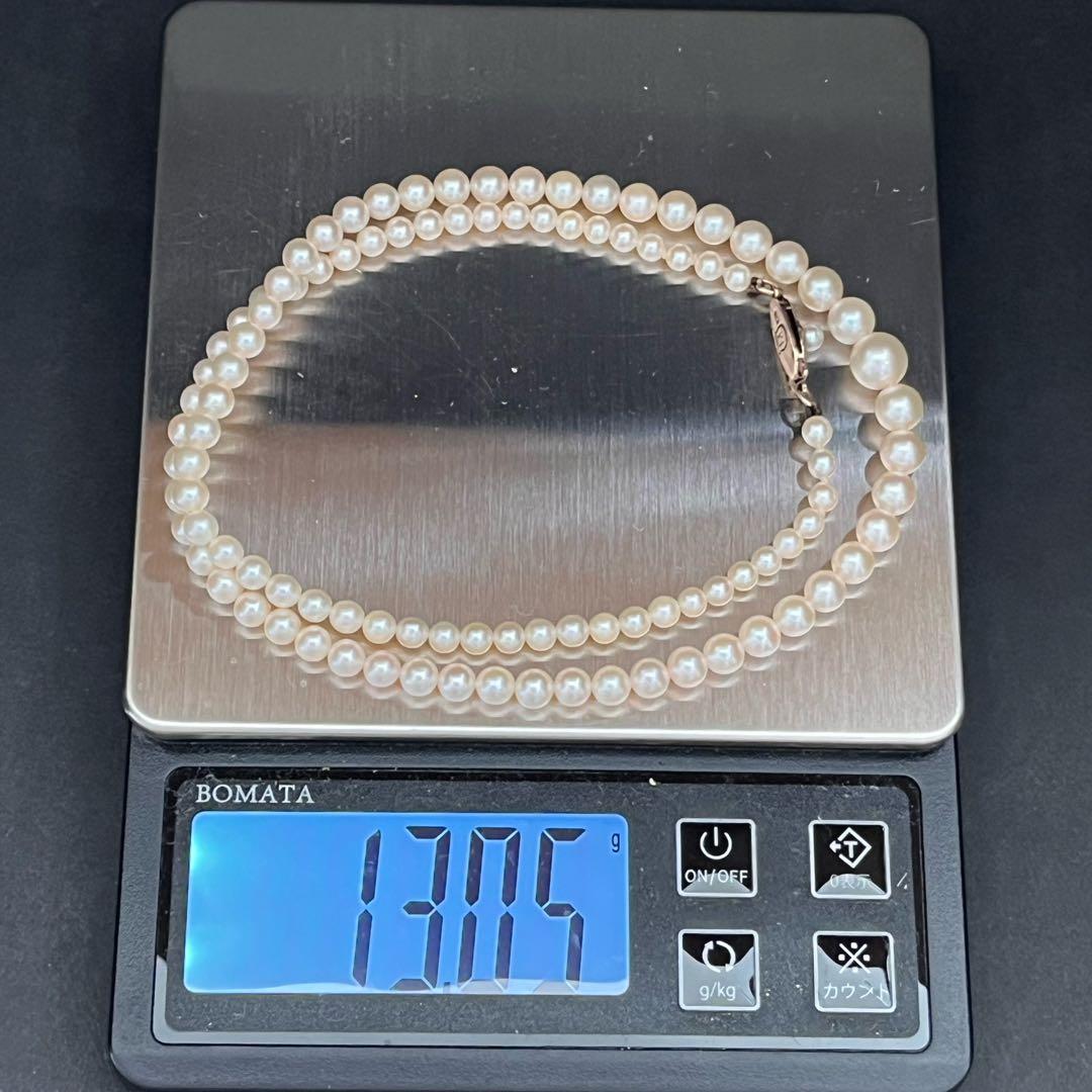 MIKIMOTO Gradient Necklace with cultured pearls ranging 3.6 to 7.0 mm and K10 metal clasp on a white background