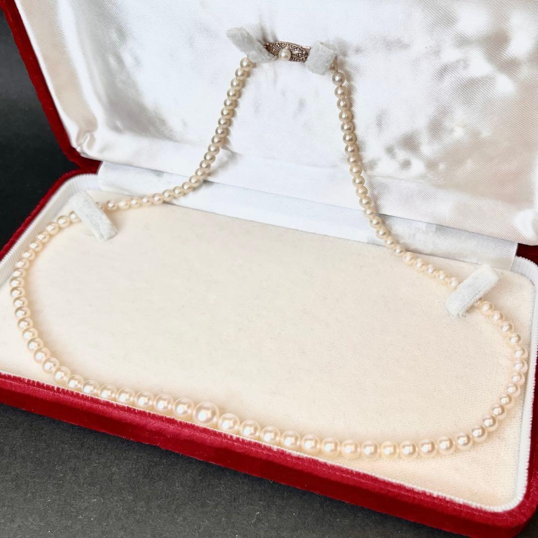 MIKIMOTO Gradient Necklace with cultured pearls ranging 3.6 to 7.0 mm and K10 metal clasp on a white background