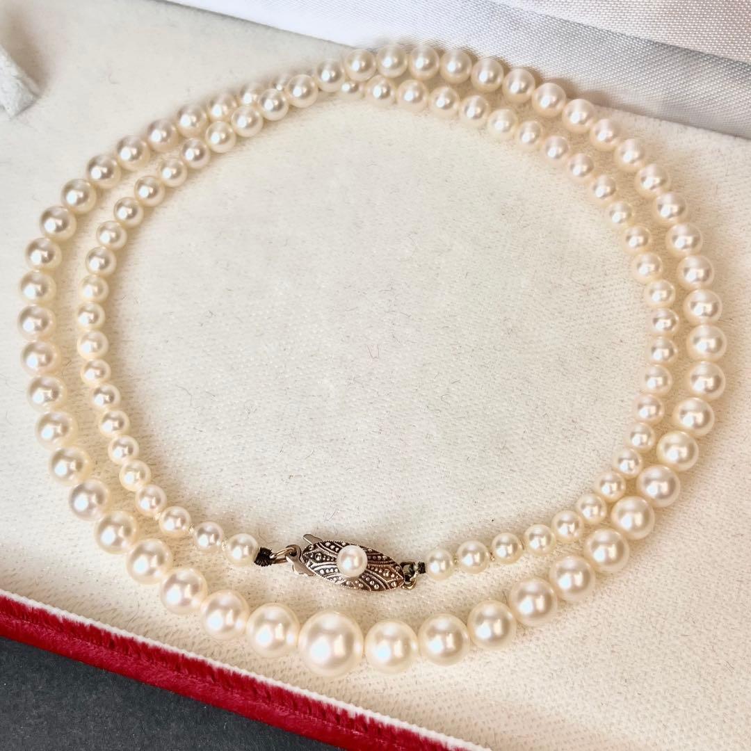 MIKIMOTO Gradient Necklace with cultured pearls ranging 3.6 to 7.0 mm and K10 metal clasp on a white background