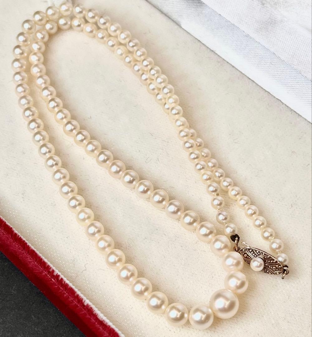 MIKIMOTO Gradient Necklace with cultured pearls ranging 3.6 to 7.0 mm and K10 metal clasp on a white background
