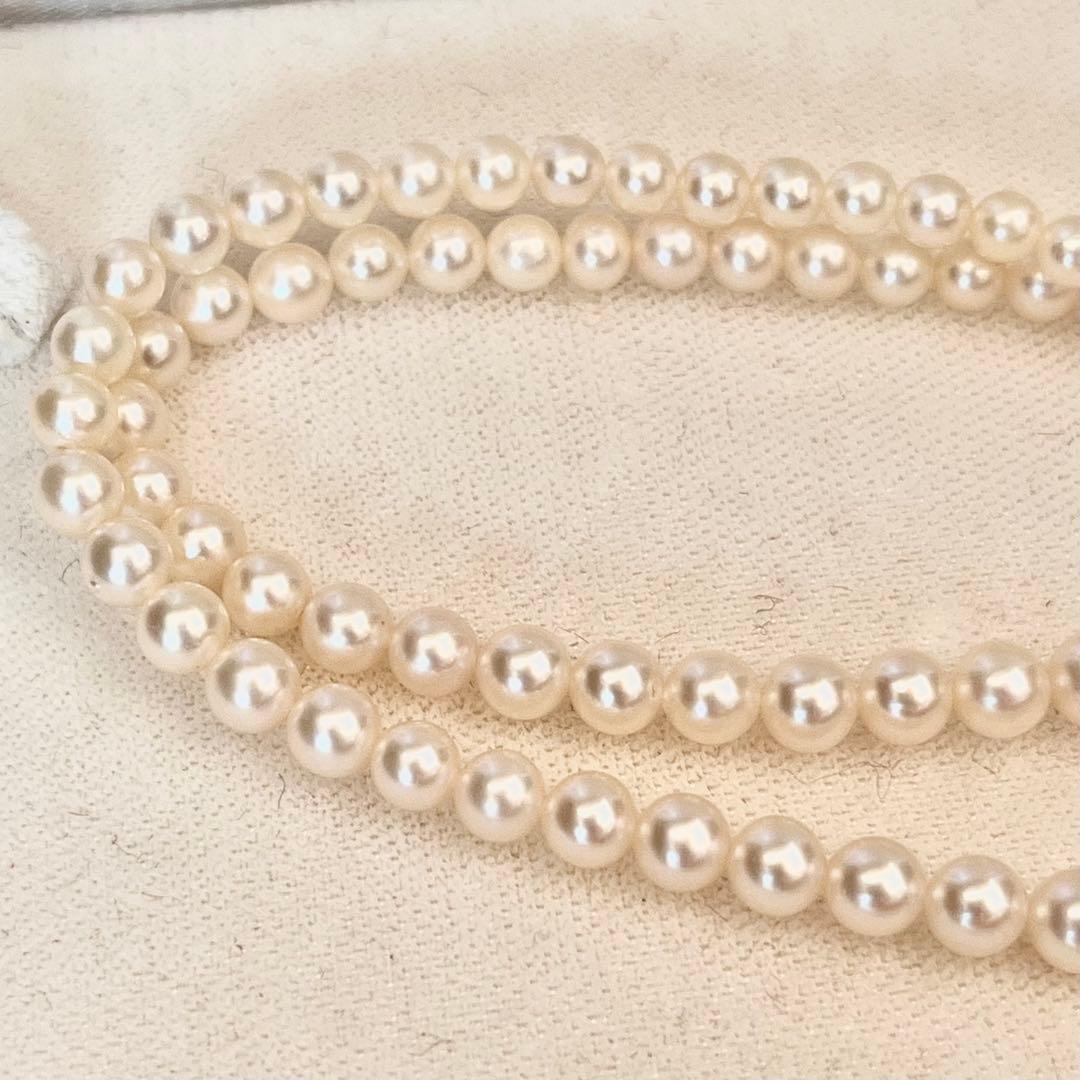 MIKIMOTO Gradient Necklace with cultured pearls ranging 3.6 to 7.0 mm and K10 metal clasp on a white background