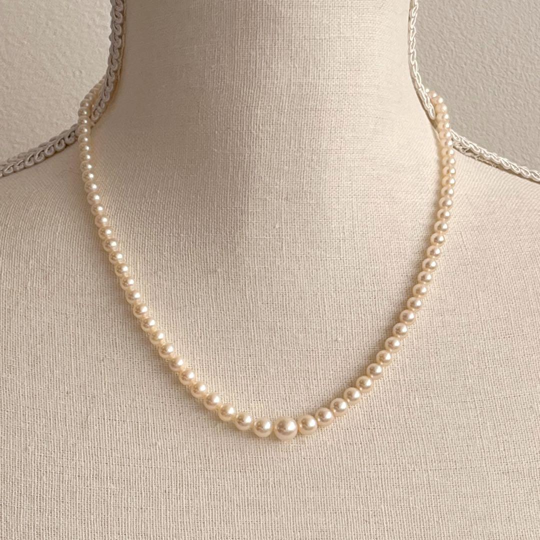 MIKIMOTO Gradient Necklace with cultured pearls ranging 3.6 to 7.0 mm and K10 metal clasp on a white background