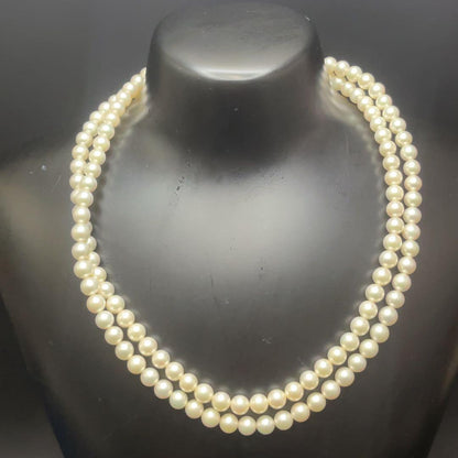 Takashi Akoya pearl two-strand necklace with silver clasp and 6-6.5 mm pearls on a white background