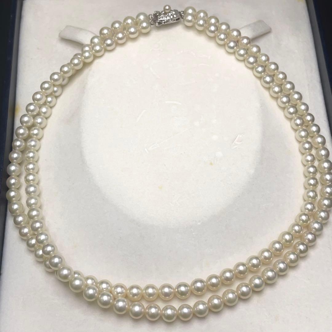 Takashi Akoya pearl two-strand necklace with silver clasp and 6-6.5 mm pearls on a white background