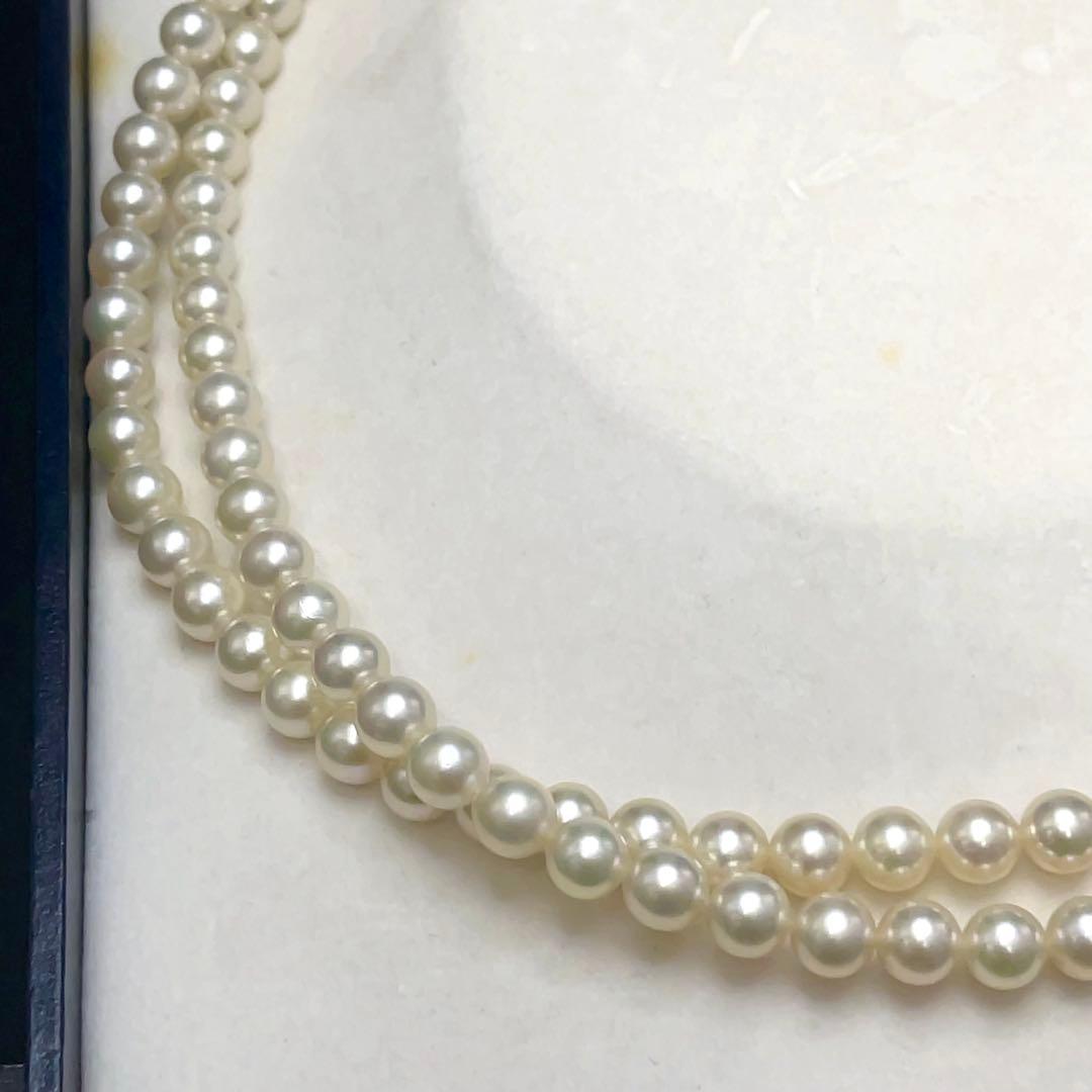 Takashi Akoya pearl two-strand necklace with silver clasp and 6-6.5 mm pearls on a white background