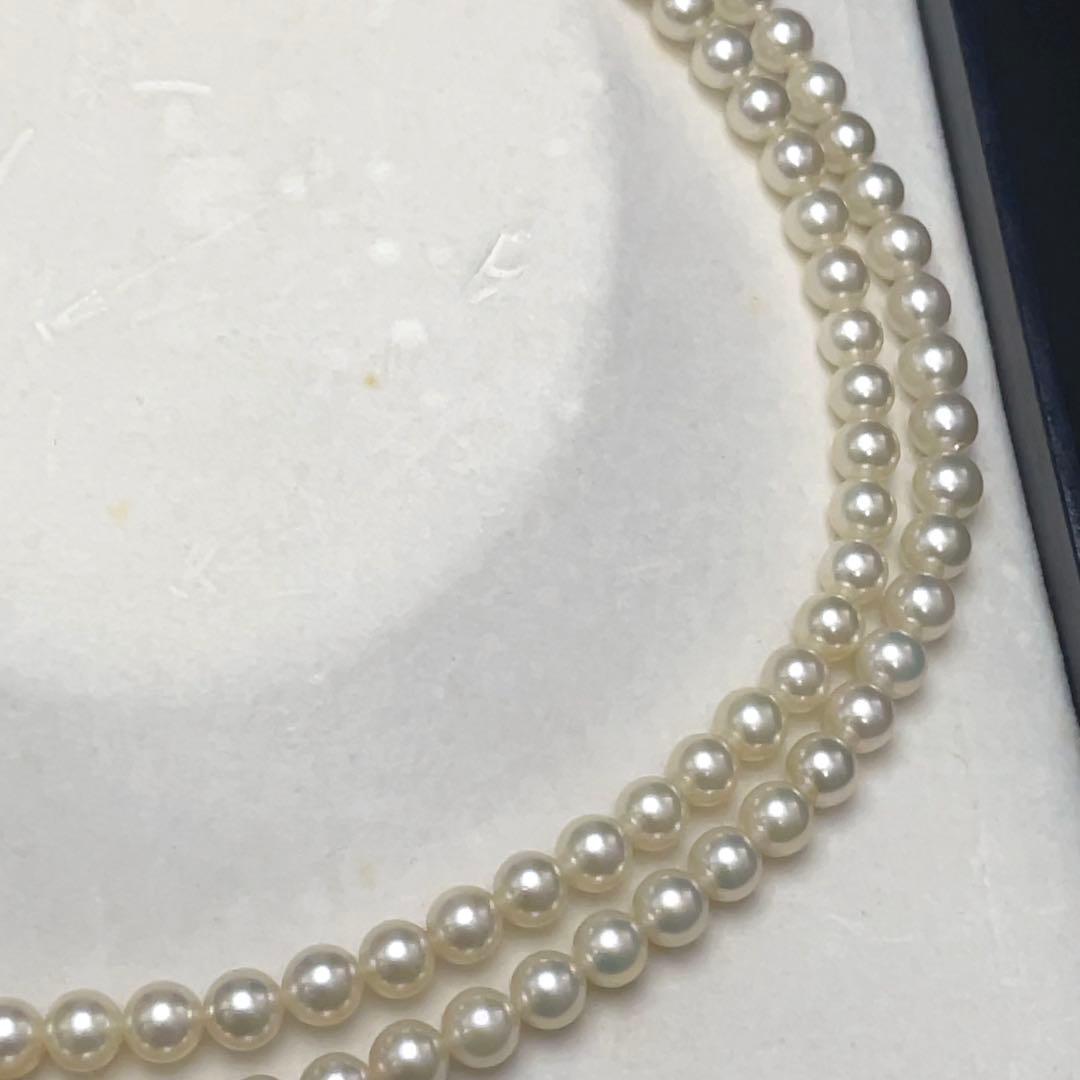 Takashi Akoya pearl two-strand necklace with silver clasp and 6-6.5 mm pearls on a white background