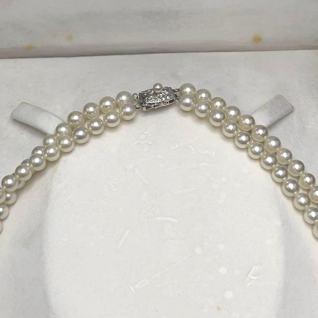 Takashi Akoya pearl two-strand necklace with silver clasp and 6-6.5 mm pearls on a white background