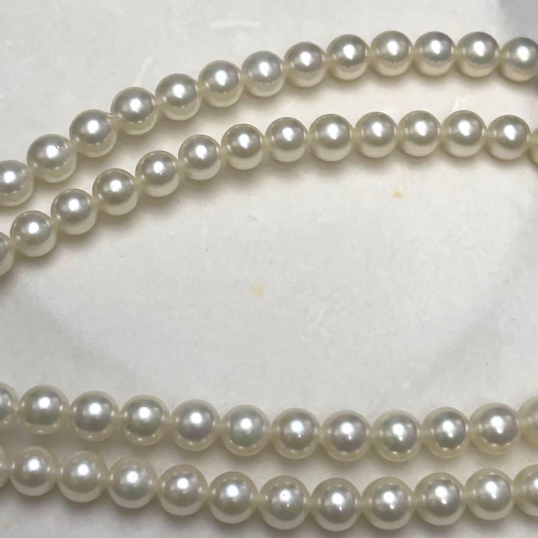 Takashi Akoya pearl two-strand necklace with silver clasp and 6-6.5 mm pearls on a white background