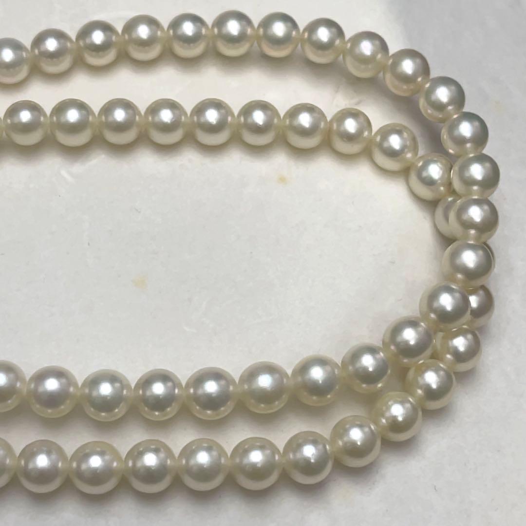 Takashi Akoya pearl two-strand necklace with silver clasp and 6-6.5 mm pearls on a white background