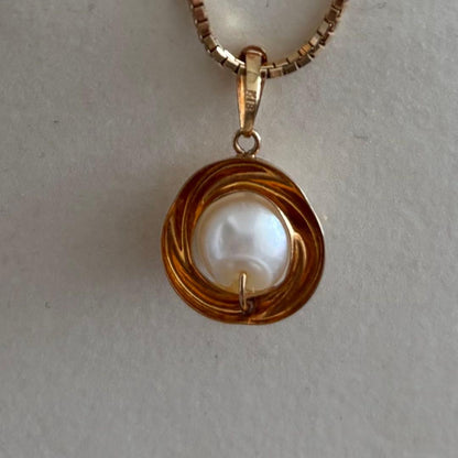 Law K18 Pearl pendant top featuring a ruby set in 18K gold with no chain or case included