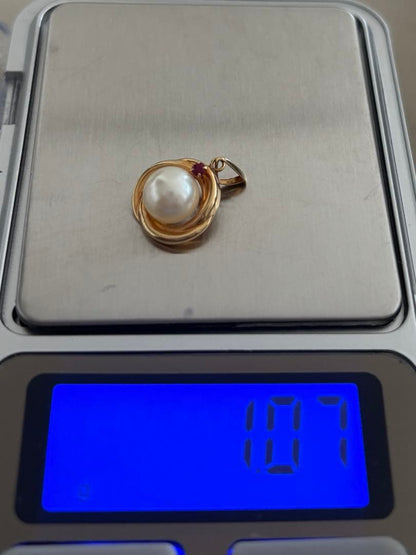 Law K18 Pearl pendant top featuring a ruby set in 18K gold with no chain or case included