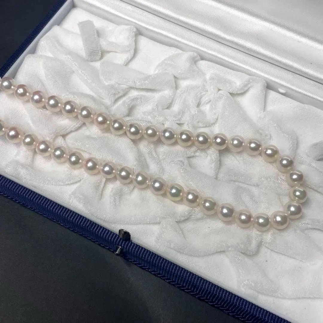 Akoya pearl necklace featuring 7.0-7.4mm pearls and 50cm length displayed on white background