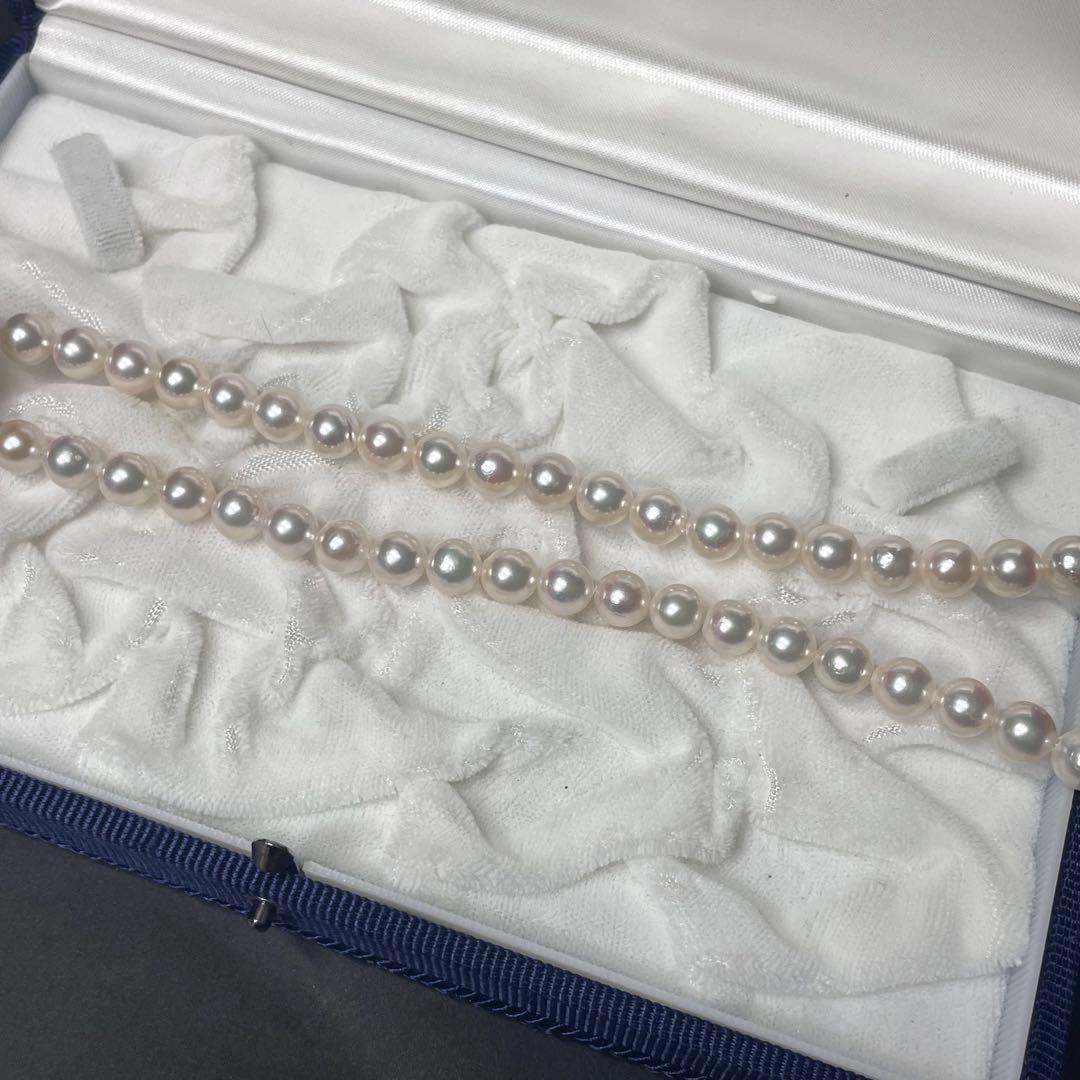 Akoya pearl necklace featuring 7.0-7.4mm pearls and 50cm length displayed on white background