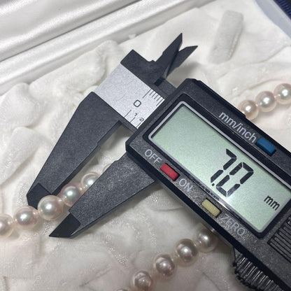 Akoya pearl necklace featuring 7.0-7.4mm pearls and 50cm length displayed on white background