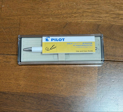 PILOT Ballpoint Pen coupe model with sleek black body and silver clip on white background