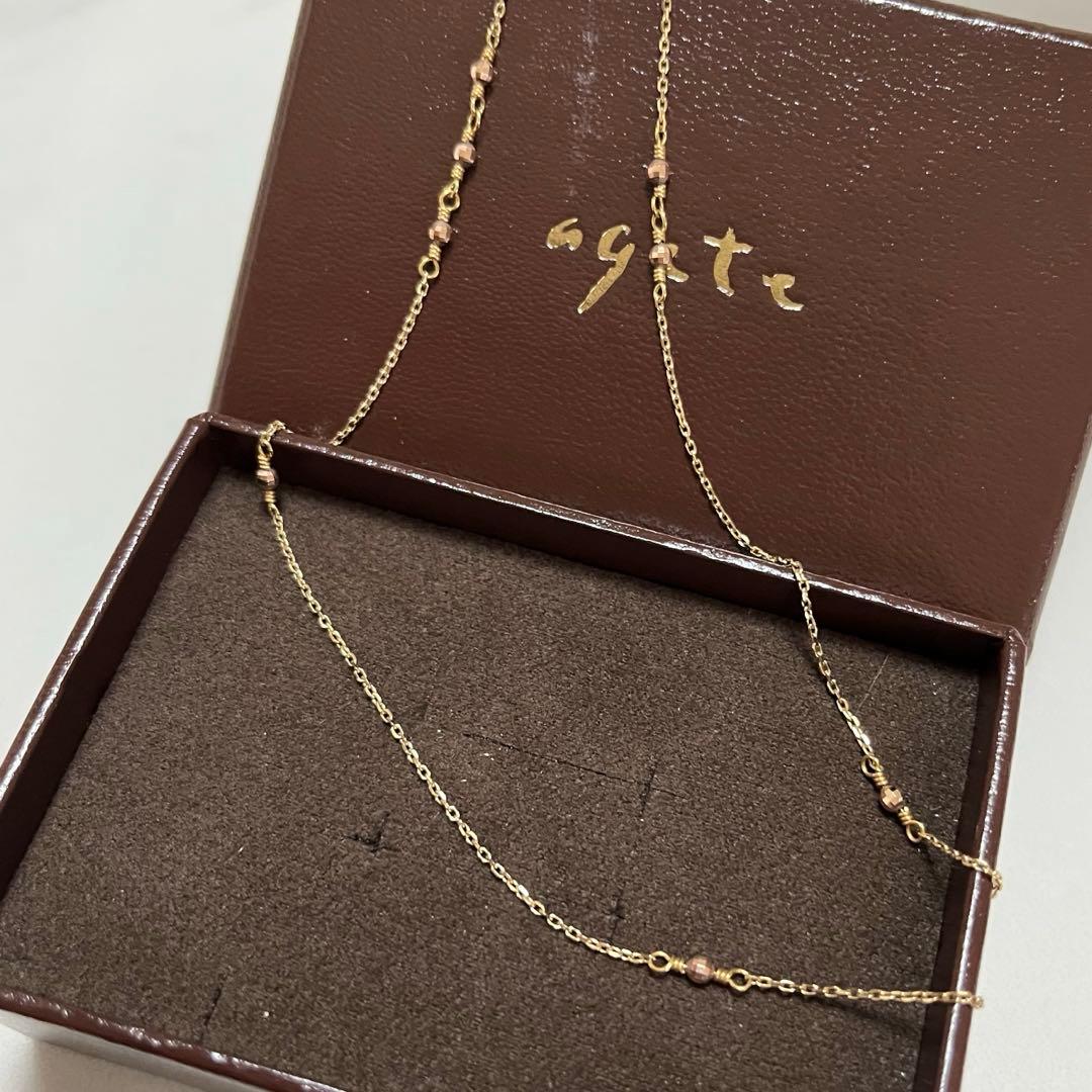 Agate K10 long necklace 40 cm with several cutpole points and faint brand engraving, gently used