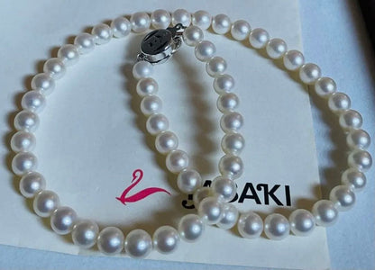 Tasaki pearl necklace featuring 7mm Akoya pearls with 42.5cm princess length and silver clasp
