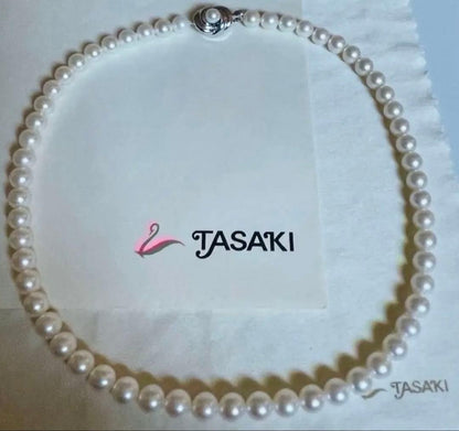 Tasaki pearl necklace featuring 7mm Akoya pearls with 42.5cm princess length and silver clasp