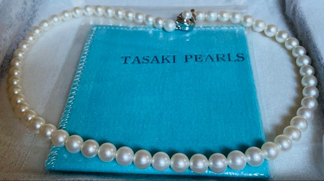 Tasaki pearl necklace featuring 7mm Akoya pearls with 42.5cm princess length and silver clasp