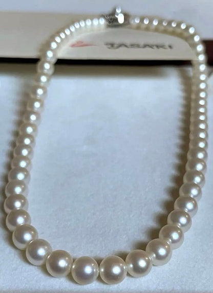 Tasaki pearl necklace featuring 7mm Akoya pearls with 42.5cm princess length and silver clasp
