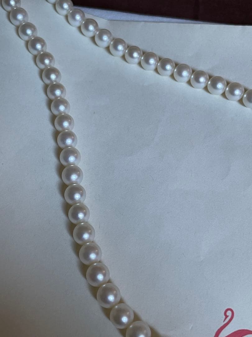 Tasaki pearl necklace featuring 7mm Akoya pearls with 42.5cm princess length and silver clasp