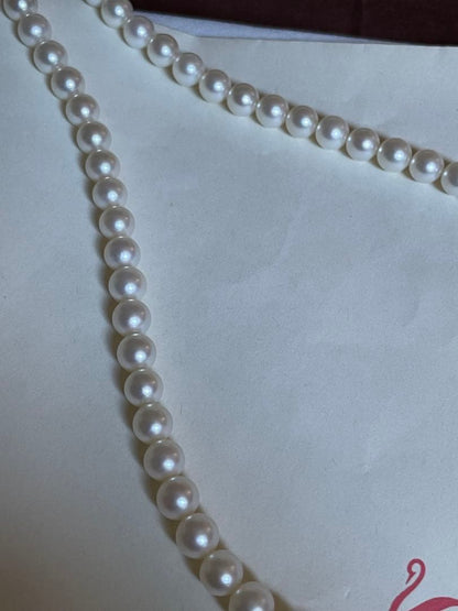 Tasaki pearl necklace featuring 7mm Akoya pearls with 42.5cm princess length and silver clasp