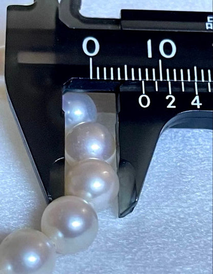 Tasaki pearl necklace featuring 7mm Akoya pearls with 42.5cm princess length and silver clasp