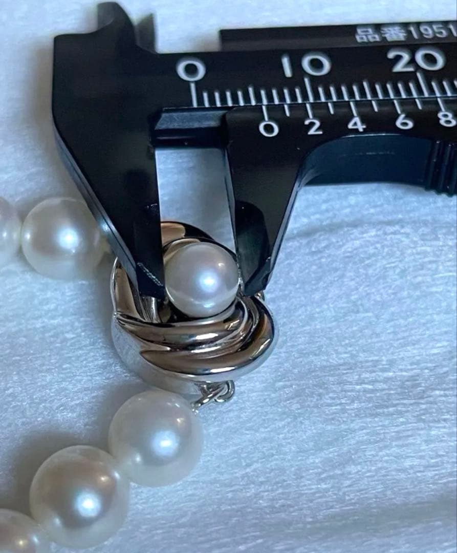 Tasaki pearl necklace featuring 7mm Akoya pearls with 42.5cm princess length and silver clasp