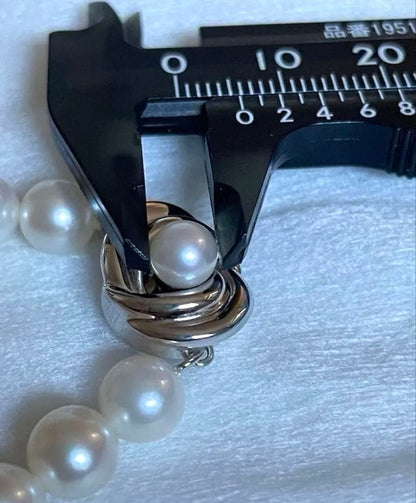 Tasaki pearl necklace featuring 7mm Akoya pearls with 42.5cm princess length and silver clasp