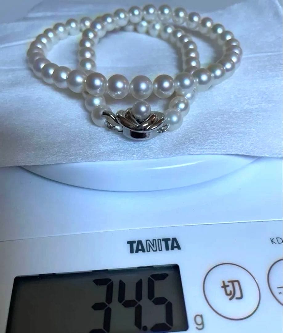 Tasaki pearl necklace featuring 7mm Akoya pearls with 42.5cm princess length and silver clasp