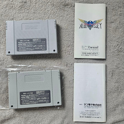 SNES Albert Odyssey 1 and 2 Set game cartridges with original labels for RPG titles by Sunsoft