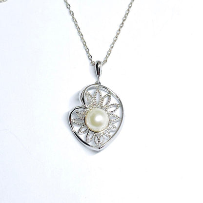MIKIMOTO Pearl Necklace Pendant Top featuring a 7.2mm pearl set in silver with total weight 2.7g