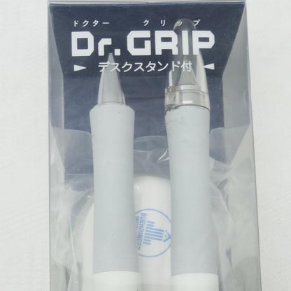 Dr.GRIP initial model ballpoint pen and mechanical pencil set with black desk stand on white background