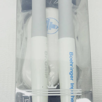 Dr.GRIP initial model ballpoint pen and mechanical pencil set with black desk stand on white background