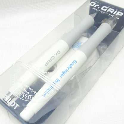 Dr.GRIP initial model ballpoint pen and mechanical pencil set with black desk stand on white background