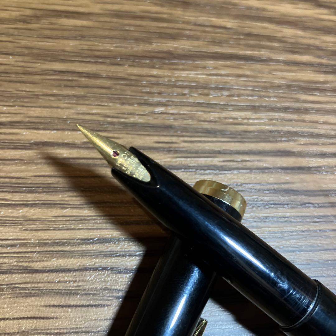 Pilot Black Cap Fountain Pen with black body and gold-plated nib and tip shown on white background